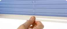 Pleated and Cellular blinds using the Intu System are operated using a discrete tab handle on the bottom bar.